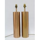 A pair of copper coloured metal table lamp bases, (2) 48cm.