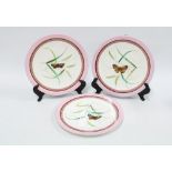 Three 19th century porcelain plates, pink rims and butterfly patterns (3) 23cm.