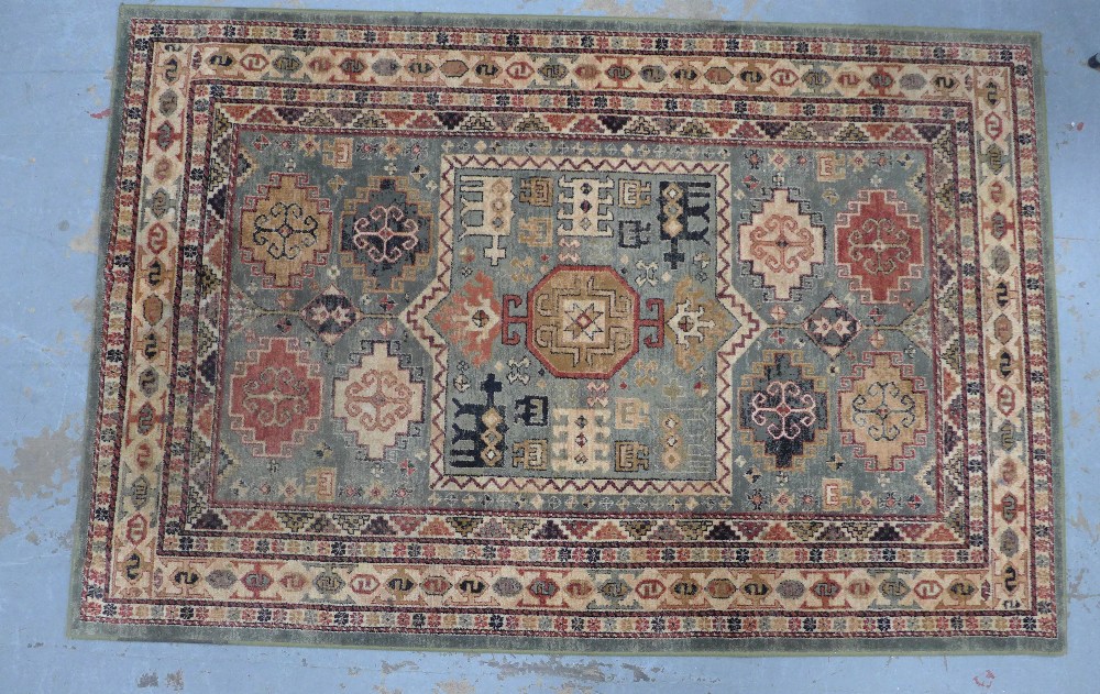 Persian rug with olive field and geometric motifs, 201 x 134cm.