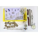 A collection of silver and costume jewellery to include silver bracelets, paste brooches, gtwo