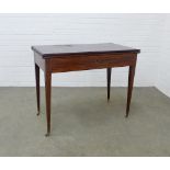 Edwardian mahogany and inlaid foldover tea table with frieze drawer on tapering leg, on brass caps