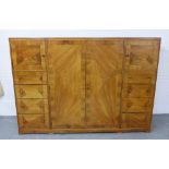 Whytock & Reid walnut wardrobe, flat top with rounded edge over a pair of central robe doors which