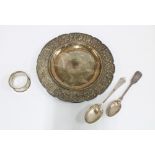 Eastern white metal dish, circular with repousse border of figures, lions, flowers, etc, 20cm