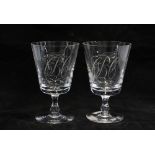 A pair of etched glass rummers, the bowls with flag and bird motifs and monogrammed C B C, 13cm (2)