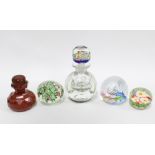 Caithness glass scent bottle and stopper, together with three glass paperweights and another (5)