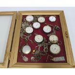A collection of ten silver cased pocket watches, some with silver albert chains and silver fobs