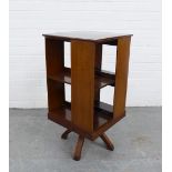 Mahogany revolving bookcase, the top quarter veneered and with chequer banding, 77 x 39 x 38cm.