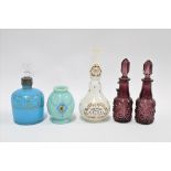 Four glass perfume bottles to include one inscribed Charles of The Ritz - Moss Rose, together with a