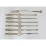 Sheffield silver pickle fork and a set of six silver plated lobster picks (7)