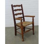 A child's elm ladder back Lancashire style open armchair. 76 x 43 x 30cm.