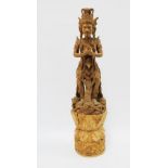 Eastern deity, carved wooden figure on a tall base, possibly Indian (in two parts) 69cm.