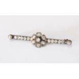 Antique diamond bar brooch set in unmarked white metal with a yellow metal pin, with a central