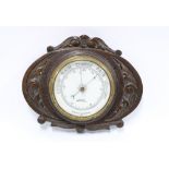 Aitchison carved oak aneroid wall barometer, 23 x 28cm.