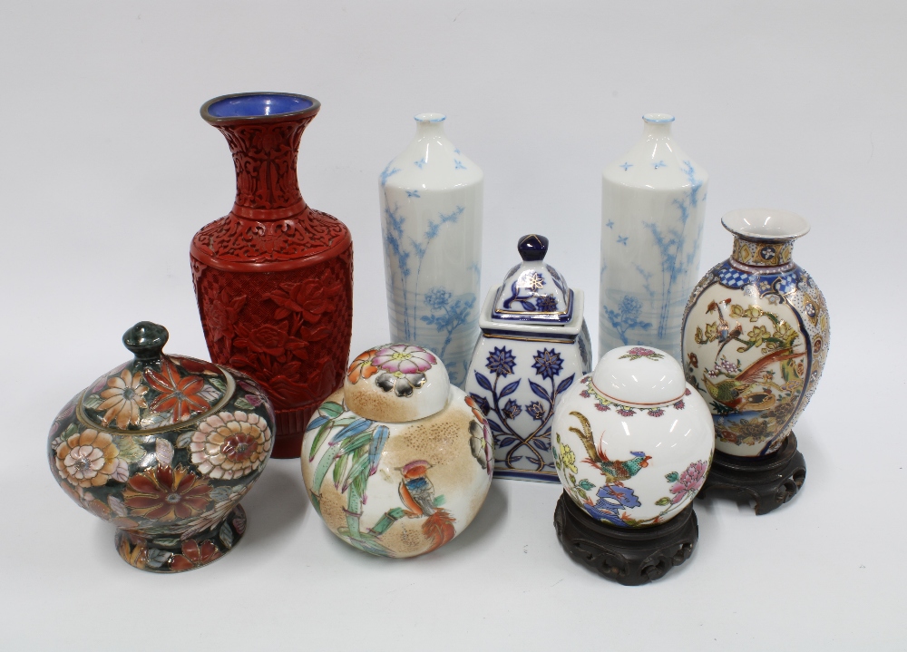 A collection of Chinese and Japanese vases to include a pair of Japanese blue and white porcelain