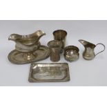 A collection of Eastern and continental white metal items to include a sauce boat, beaker, small