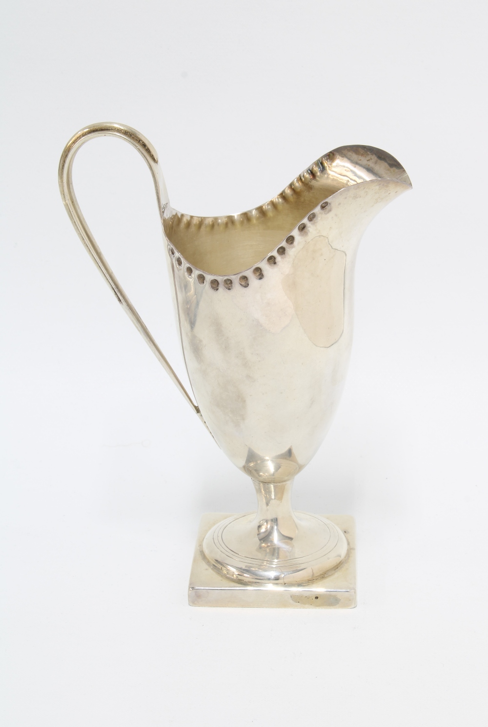 Georgian silver cream jug, London 1801, helmet form with punched ri and square footrim, 14cm - Image 2 of 3