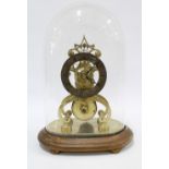 Brass skeleton clock, fusee movement, chapter ring with roman numerals, on a wooden base with