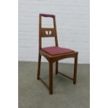 An arts & craft oak chair, in the manner of Charles Rennie Mackintosh, the splat back with pierced