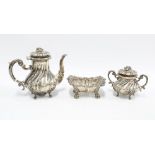 Continental silver, part bachelors set comprising teapot, sugar bowl and cover, with faux ivory