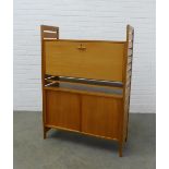 Teak wall cabinet with slatted sides, fall front, single shelf and pair of base cupboards, 93 x
