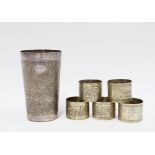 Eastern white metal beaker with engraved pattern and five white metal napkin rings (6)