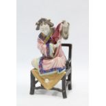 Chinese polychrome enamelled female figure, seated on a chair, 23cm