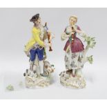 A pair of Meissen porcelain Shepherd and Shepherdess porcelain figures, the male figure with