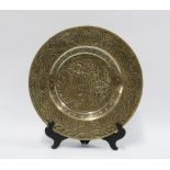 Chinese brass charger with two figures and lotus leaves within a dragon border, 27cm diameter