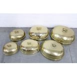 Six brass meat dish covers, largest 39 x 34cm (6)