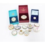 A collection of enamel pill boxes to include Halcyon Days and Staffordshire enamels together with