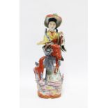 Chinese polychrome enamelled female figure with deer and a basket of flowers, 37cm