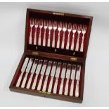 Mahogany canteen with set of twelve Epns and mother of pearl fruit knives and forks