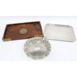 A white metal circular dish with frilled edge and hammered finish, 25cm diameter, together with an