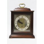 Mahogany cased mantle clock with silvered dial and roman numerals, presentation plaque dated 1958,