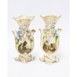 Pair of 19th century rococo style vases, floral encrusted with painted landscape scenes, each with a