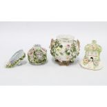 Collection of small floral encrusted porcelain, to include a cottage, shoe and cauldron, etc,