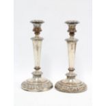 A pair of silver plate on copper rococo style candlesticks, 28cm high (2)