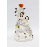 Staffordshire flatback spill vase with two figures under an apple tree, 32cm