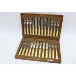 Mahogany canteen with set of twelve silver and composite handled fish knives and forks, by Elkington