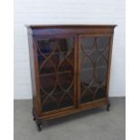 Mahogany display cabinet with two astragal glazed doors and shelved interior, on short cabriole
