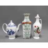 Chinoiserie pottery to include a teapot, bamboo vase and jug (3)