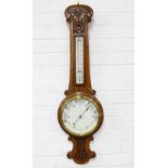 Oak cased banjo wall barometer with floral carving, 91 x 26cm