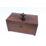 Georgian mahogany box, the hinged lid with a carved finial, the interior with two compartments,