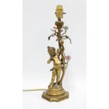 Vintage gilt metal table lamp with a cherub, leaves, and porcelain flowers 38cm