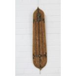 Solomon Islands wicker shield, black stain geometric decoration and with handle, 82 x 16cm