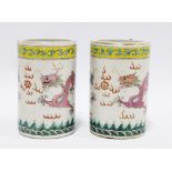 Pair of Chinese brush pots decorated with blue and pink dragons with five claws beneath a yellow