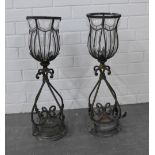 Pair of glass and metal mounted urn storm lanterns, 65cm high. (2)