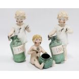 Three bisque figures of children covered in ink, the two standing both a/f, 16cm (3)