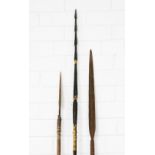 A group of three south sea islands spears to include two with metal heads and a fishing spear,