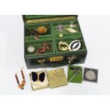 Green leather jewellery box containing costume jewellery and a Revills Coronation Velvet Butterfly